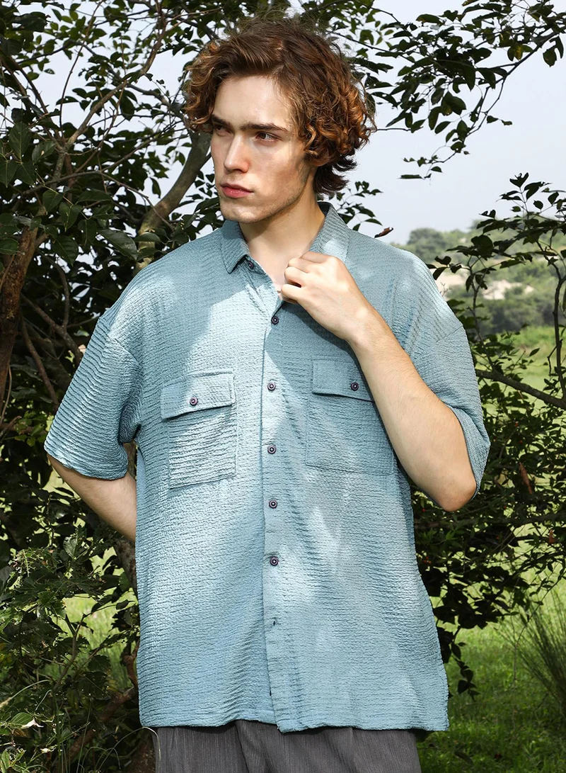 كامبوس سوترا قميص رجالي أخضر مريمي واسع بتصميم عملي للملابس الكاجوال بياقة عادية وأكمام قصيرة