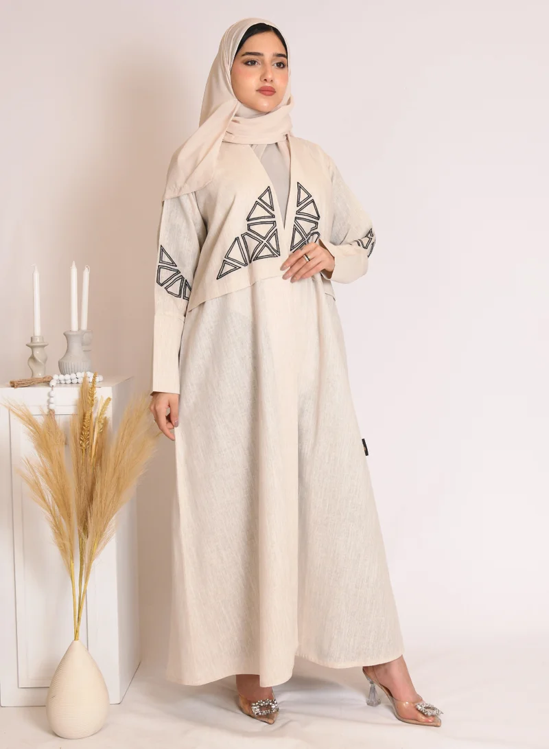 HAWRAA ABAYA Beige wrap abaya with black embroidery