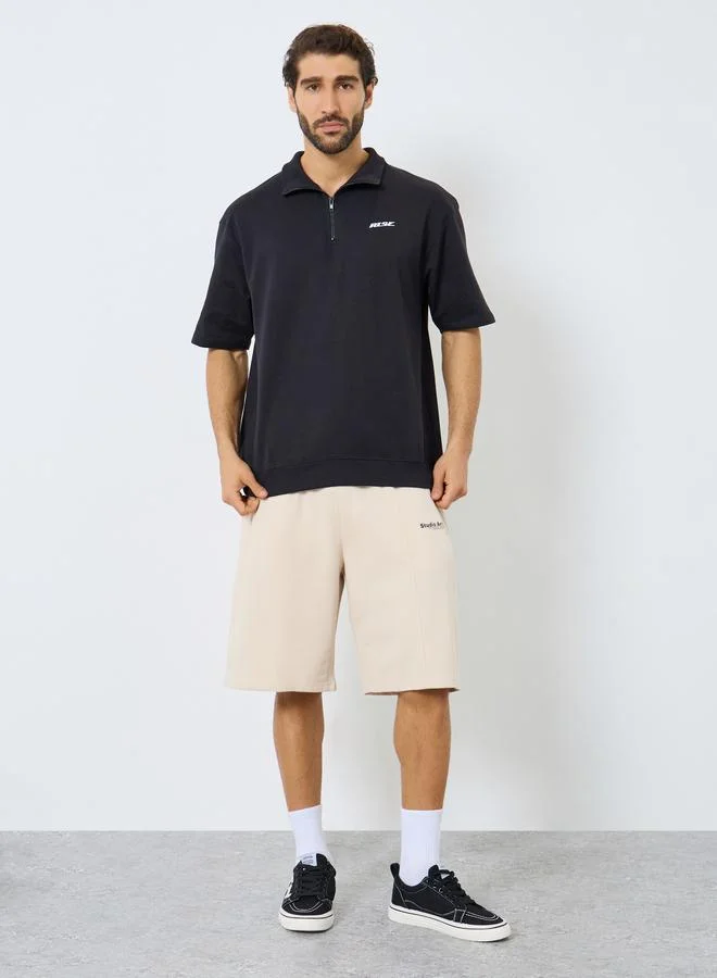Styli Men Relaxed Fit Quarter Zip Polo