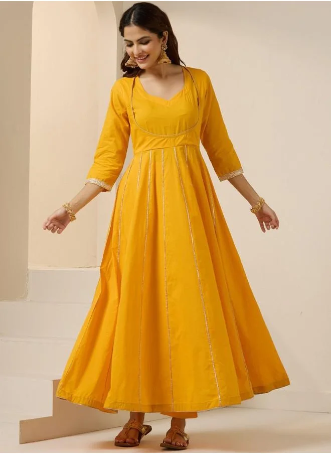 آي شين Elastic Women Yellow Cotton Kurta Set with Embroidered pattern Tunic and Palazzo features a Round neckline and Three-Fourth Sleeve secured with Elastic closure and styled in Straight Fit ideal for Festive moments — a must-have for your statement wardrobe.