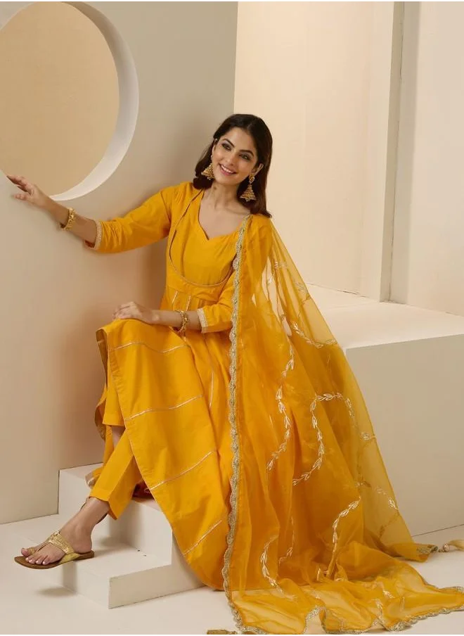 ISHIN Elastic Women Yellow Cotton Kurta Set with Embroidered pattern Tunic and Palazzo features a Round neckline and Three-Fourth Sleeve secured with Elastic closure and styled in Straight Fit ideal for Festive moments — a must-have for your statement wardrobe.