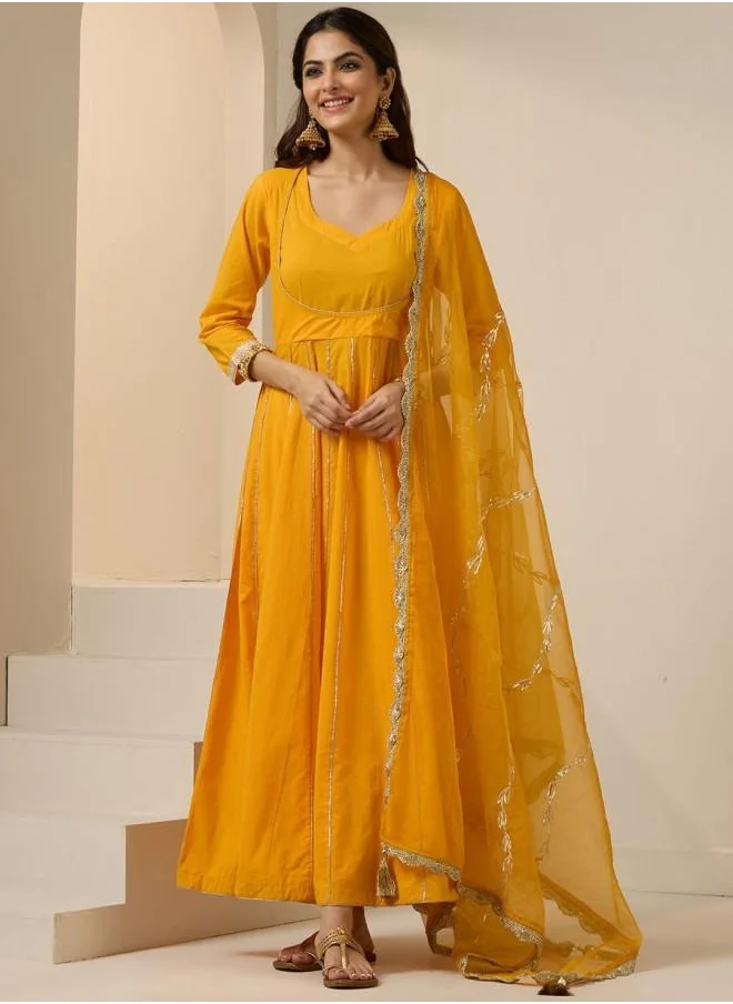 ISHIN Elastic Women Yellow Cotton Kurta Set with Embroidered pattern Tunic and Palazzo features a Round neckline and Three-Fourth Sleeve secured with Elastic closure and styled in Straight Fit ideal for Festive moments — a must-have for your statement wardrobe.