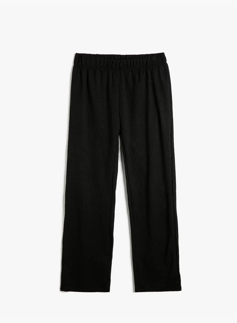 Koton  Trousers High-Rise Relax Fit Textured Standard Leg for Women | Best Price UAE
