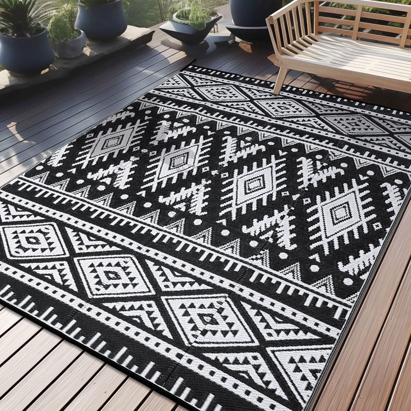 OLANLY Outdoor Rug Waterproof 6x9 ft, Reversible Outdoor Plastic Straw Rug, Boho Patio Rug, Indoor Outdoor Carpet, RV Mat Outside for Patio, Camp, Picnic, Balcony, Deck, Backyard, Black & White - Image 1