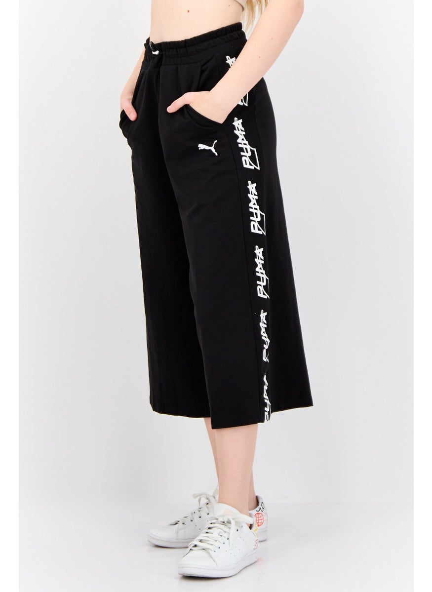 PUMA Women Sportswear Fit Brand Logo Outdoor Crop Pants, Black  - Image 4