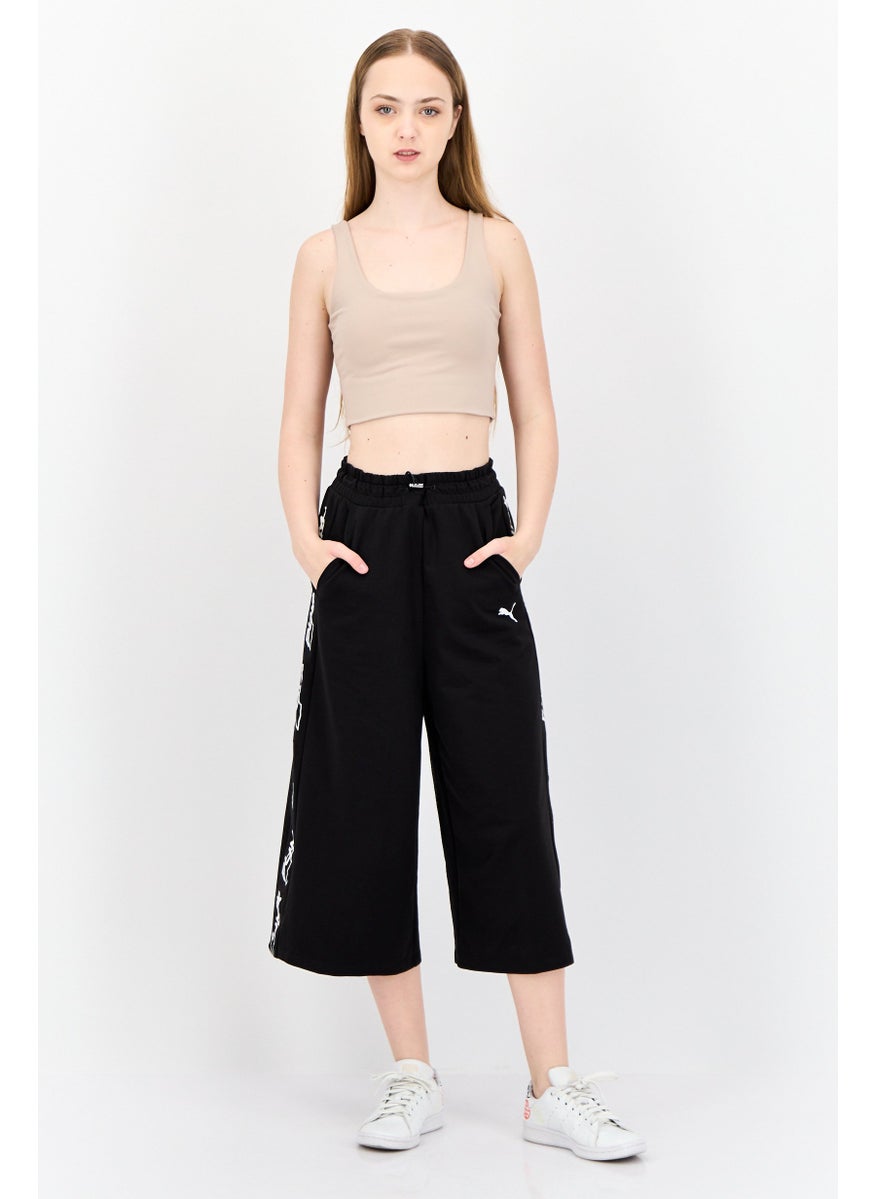 PUMA Women Sportswear Fit Brand Logo Outdoor Crop Pants, Black  - Image 3