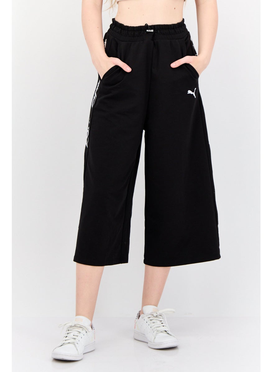 PUMA Women Sportswear Fit Brand Logo Outdoor Crop Pants, Black  - Image 1