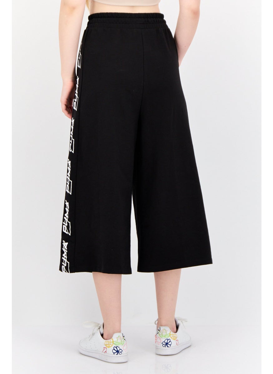 PUMA Women Sportswear Fit Brand Logo Outdoor Crop Pants, Black  - Image 2