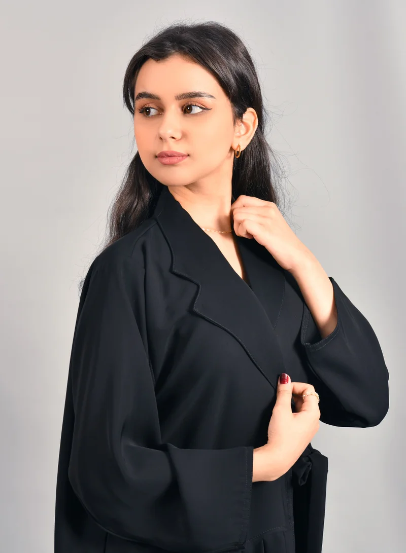 HAWRAA ABAYA Formal black wrap abaya with tie closure and pleats at the bottom