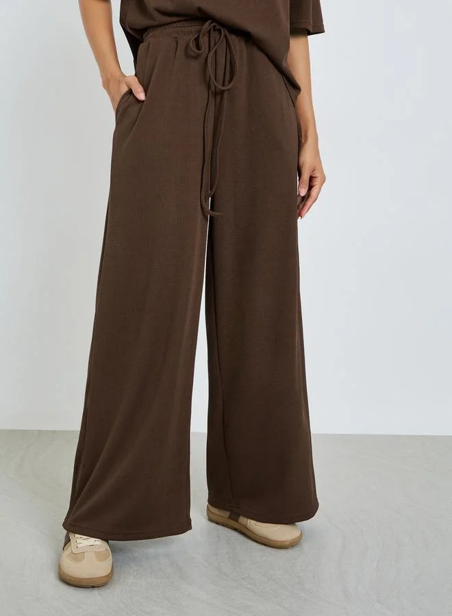 Styli Brown Brown Ribbed T-Shirt and Wide Leg Joggers Co-Ords for Women | Best Price UAE