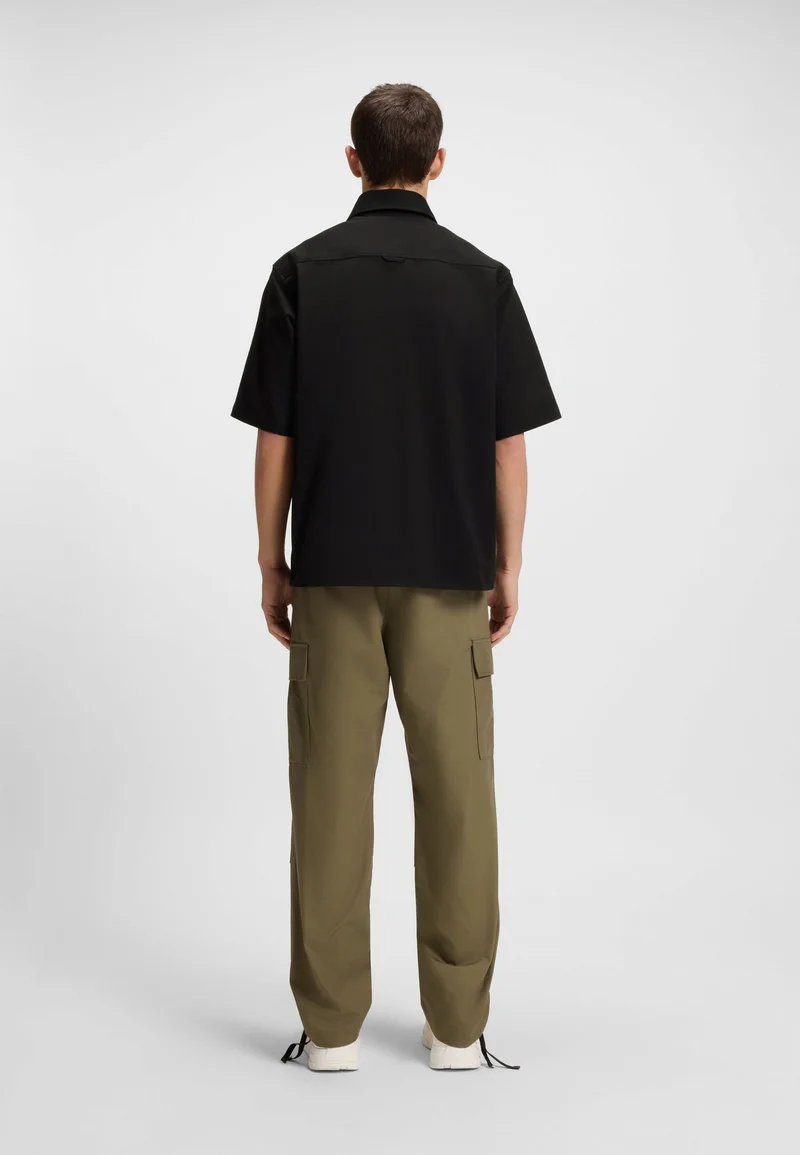 هوجو قميص بقصة واسعة وسحاب أمامي