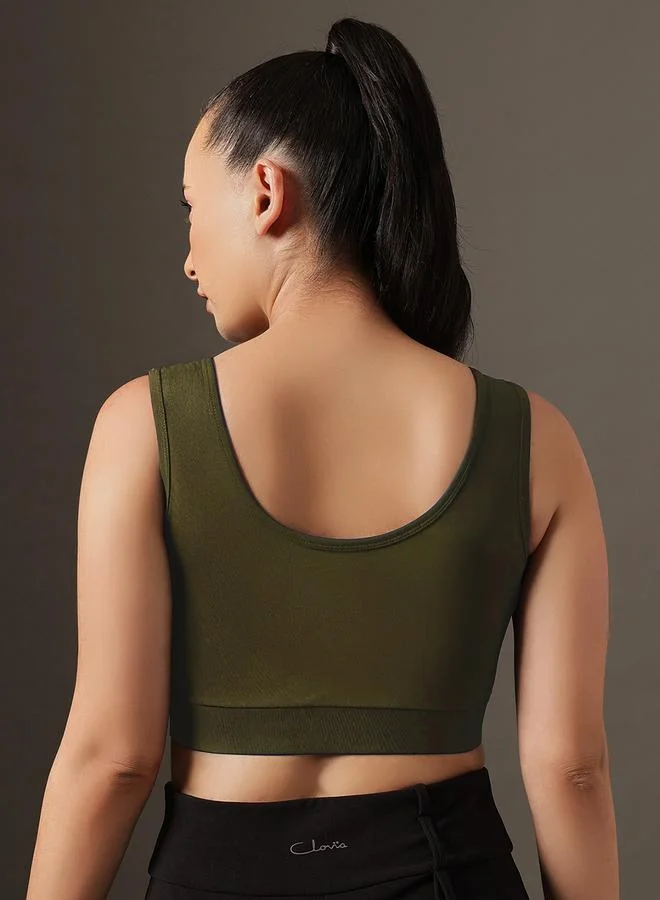 Clovia  Dark Green Solid Medium Impact Zip-Front Sports Bra for Women | Best Price UAE