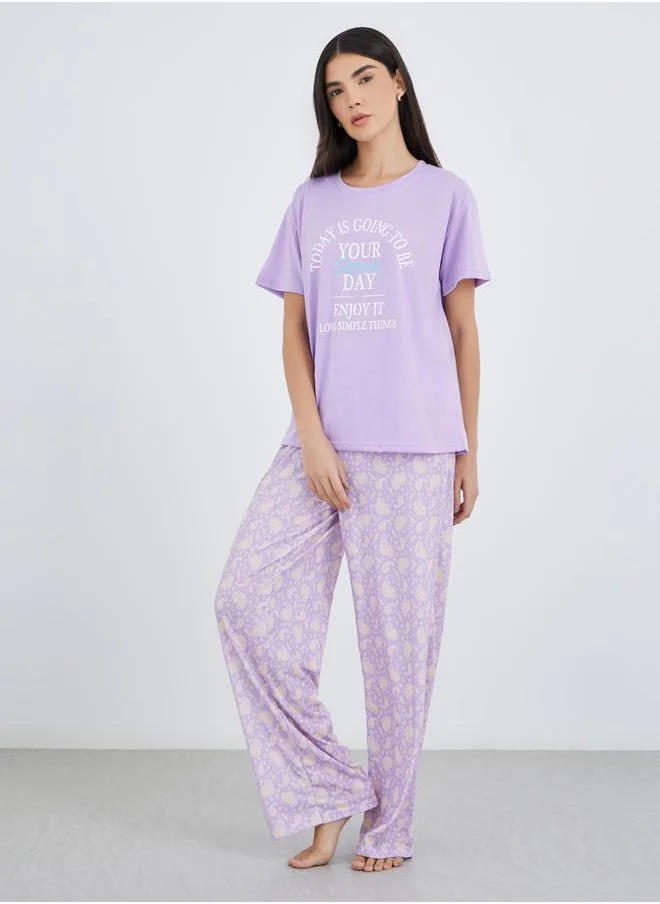 ستايلي Styli Women Lilac Slogan Print Dropped Shoulder T-Shirt and Paisley Print Pyjama Set