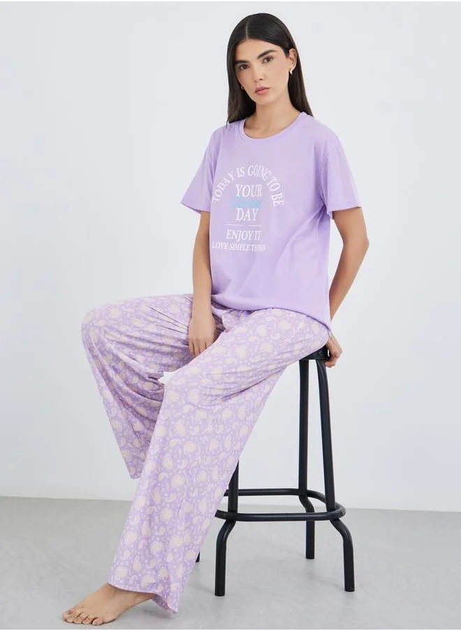 ستايلي Styli Women Lilac Slogan Print Dropped Shoulder T-Shirt and Paisley Print Pyjama Set