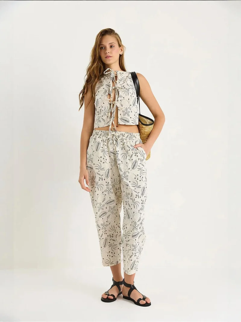 بيانكو لوتشي طقم قطعتين بدون أكمام برقبة دائرية بطبعة لوكسي