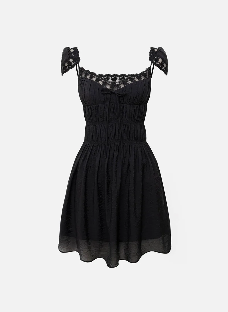 Lichi Mini dress with lace and elasticated gathers at the bodice
