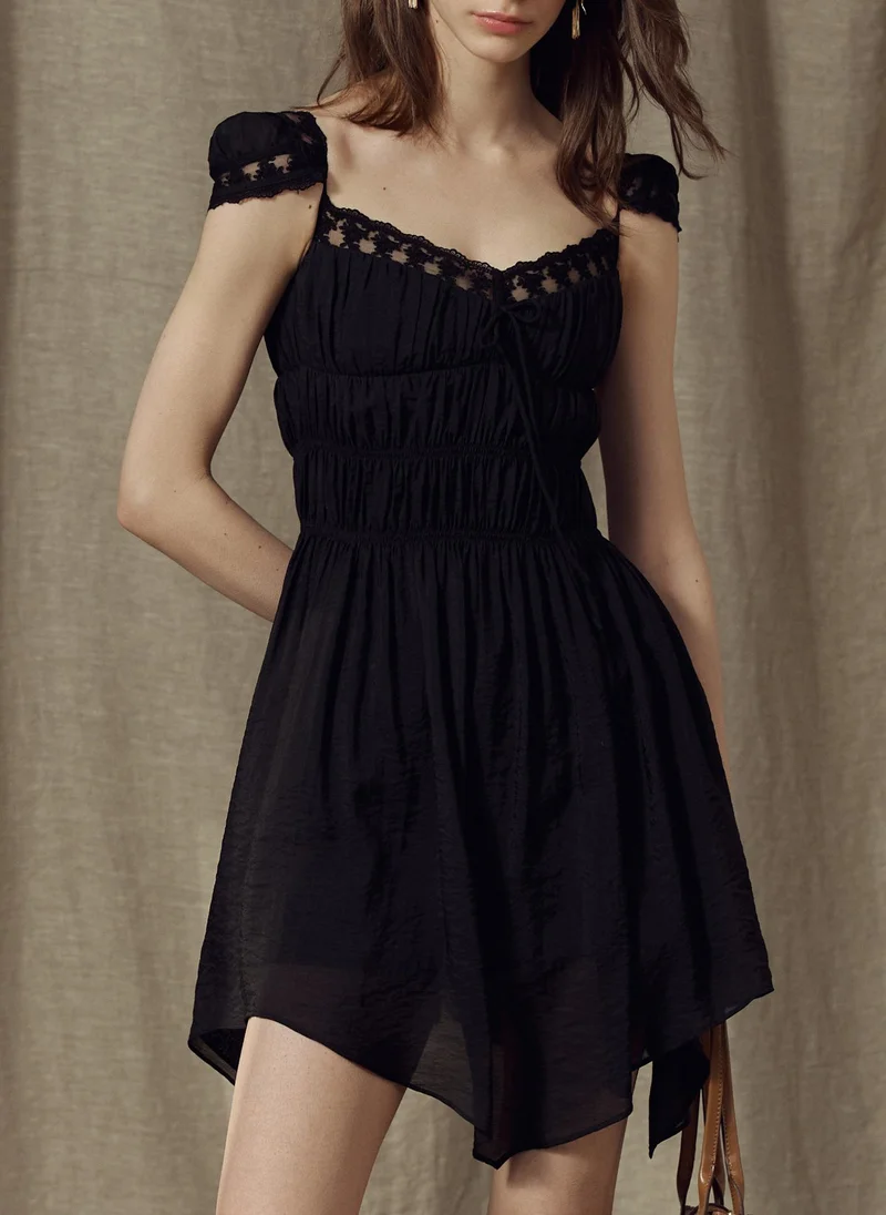 Mini dress with lace and elasticated gathers at the bodice