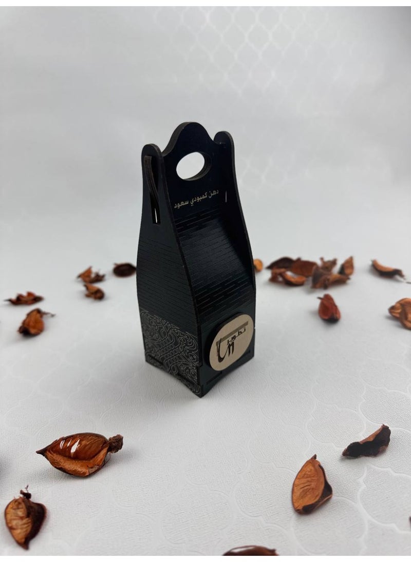 Samrix Magic Box:  Magic Box - A wooden gift box containing a quarter tola of oud oil.  ✔ Luxurious Magic Box with an elegant wooden design  ✔ Contains a quarter tola of oud oil  ✔ Suitable for upscale gifts ✔ Long-lasting and luxurious oud fragrance ✔ Sophisticated design reflecting refined taste ✔ Ideal for weddings and special occasions ✔ Perfect choice for elegant gifts ✔ High-quality wood materials ✔ Suitable size for gifts ✔ Reflects authenticity and Arabian luxury ✔ Suitable for corporate gifts ✔ Elegant packaging, ready for presentation ✔ High value for a distinctive product ✔ A simple gift with a touch of luxury ✔ Suitable for religious occasions ✔ Practical and portable design ✔ Leaves a luxurious impression on the recipient ✔ An ideal choice for oud oil lovers - Image 1