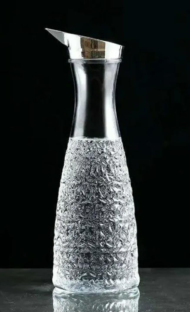 Shoppers Hub PNQ 1.1L PC Transparent Decanter Juice Water Bottle with Silver Cap and Self Embossed Design Pattern for Ideal Gifting and Heavy Duty Use in Homes, Hotels, Cafes and Commercial Places  - Image 1