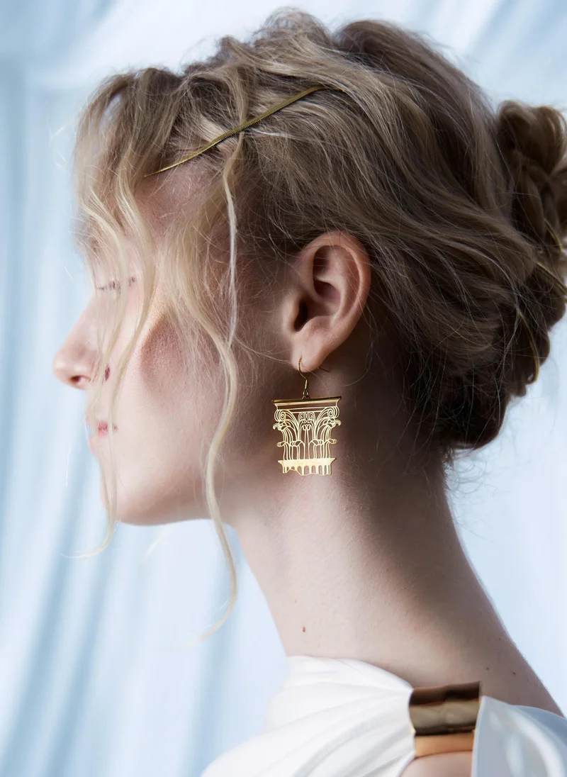 Golden stud earrings with antique decoration