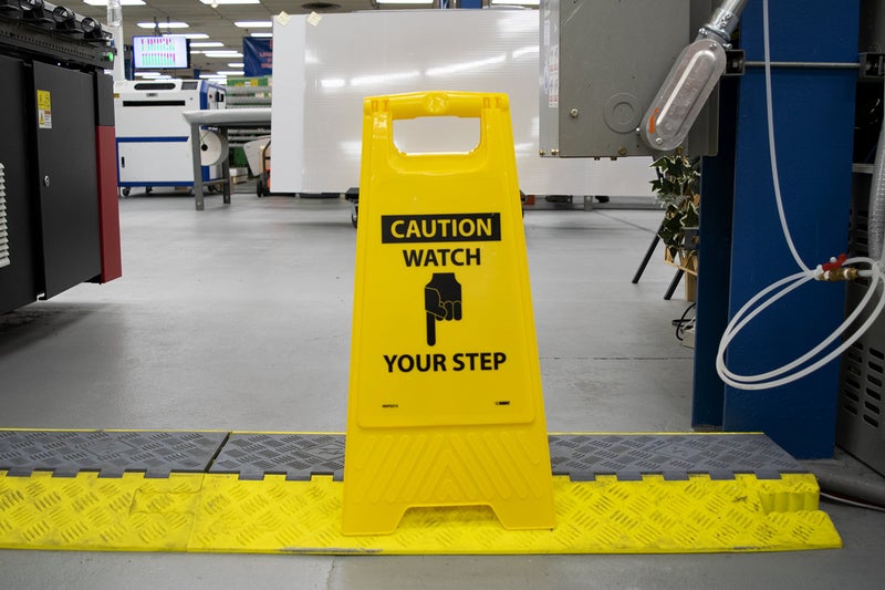 NMC HDFS213 Caution-Watch Your Step Sign with Graphic– 10.75 in. x 24.63 in. Heavy-Duty Plastic, Double-Sided Floor Sign with Black on Yellow - Image 3