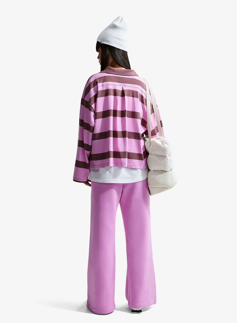 نايكي سروال رياضي واسع الساق بشعار فينيكس من نايكي فليس عالي الخصر