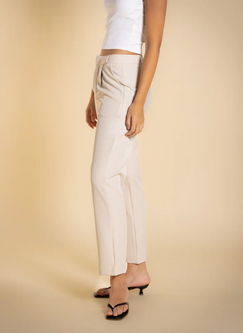 Shapes Beige PLEATED TAILORED TROUSERS for Women | Best Price UAE