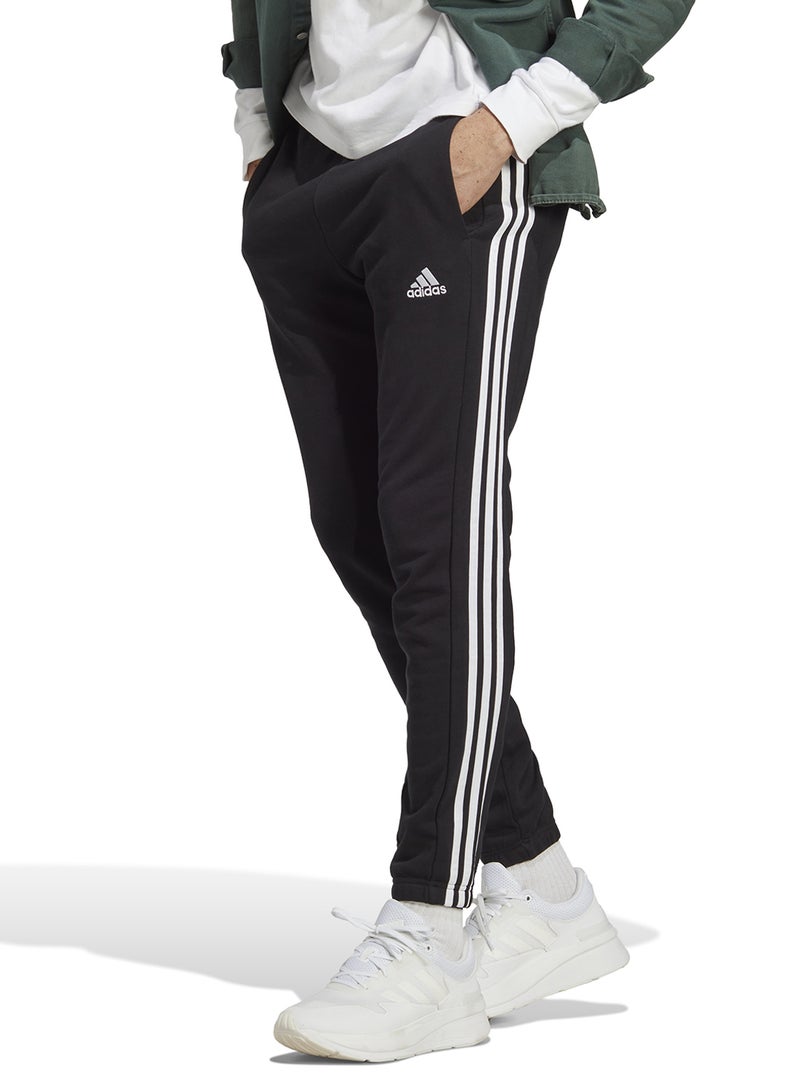 Adidas سروال جوجر من قماش فرنسي مع 3 خطوط - Image 1