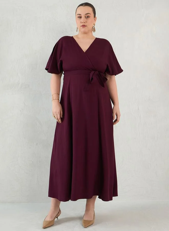 Femmella Plus Size Flared Sleeves Wrap Look A-Line Maxi Dress by Styli
