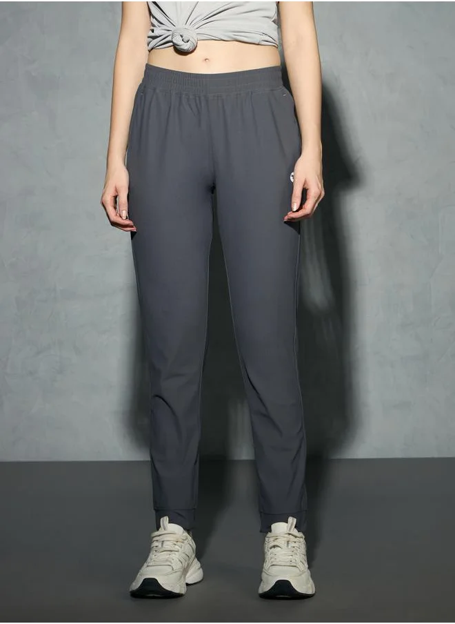 تكنوسبورت Logo Print 4-Way Stretch Joggers with Pockets by Styli