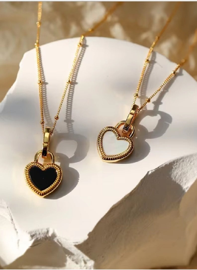 MANIKAN MANIKN Women's Necklace Dual-Faced Heart Black and White Made of Stainless Steel"  - Image 1