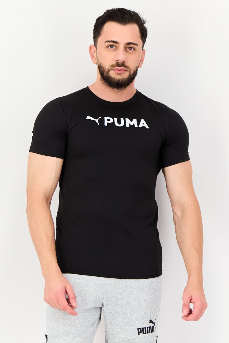 PUMA Men Sportswear Fit Brand Logo Short Sleeves Training T-Shirt, Black - Image 1