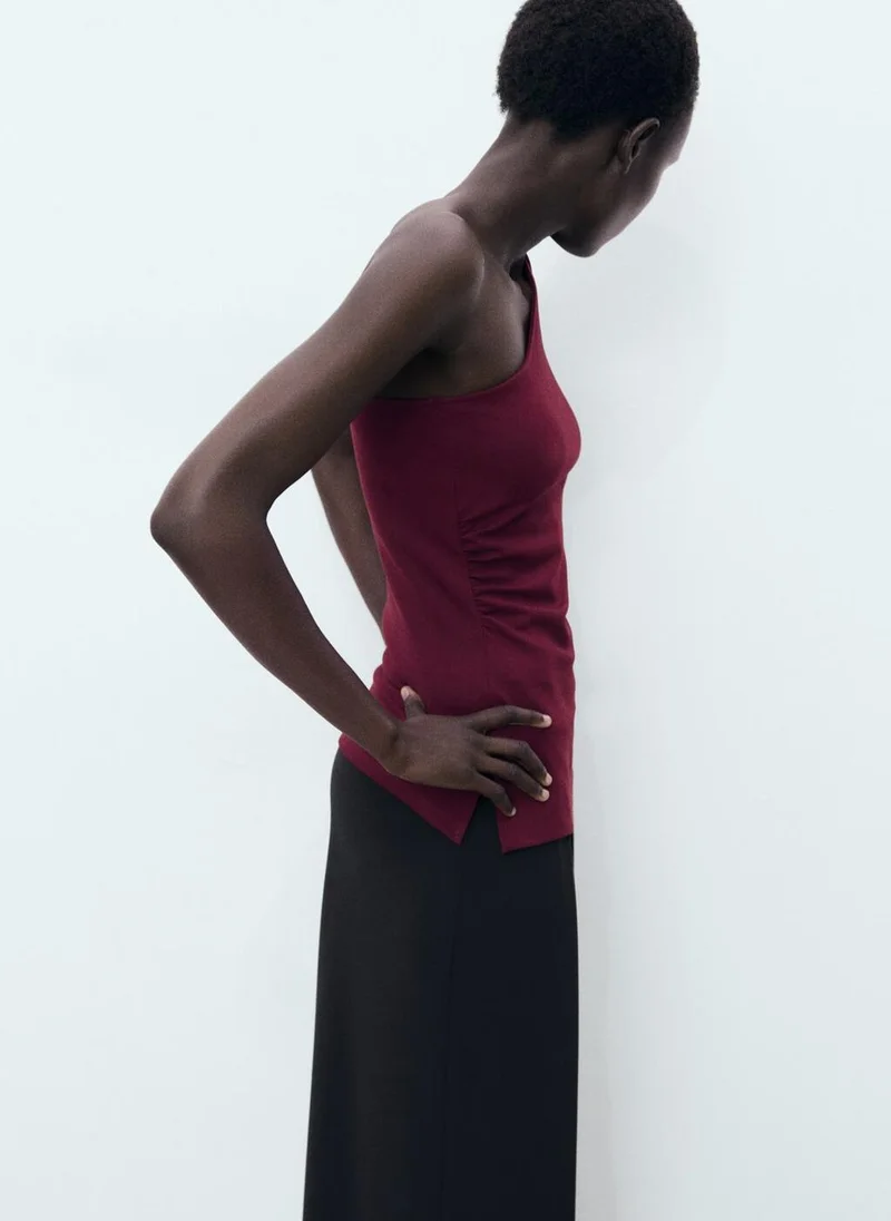 مانجو توب غير متماثل بكسرات