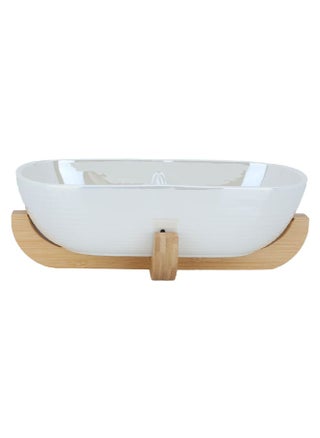 Deep oval beige porcelain serving bowl with a wooden base - pzsku/Z6A3D2D2DF20C9EFC93F3Z/45/_/1722251766/9acfeac6-996b-4061-b78b-713337566f14