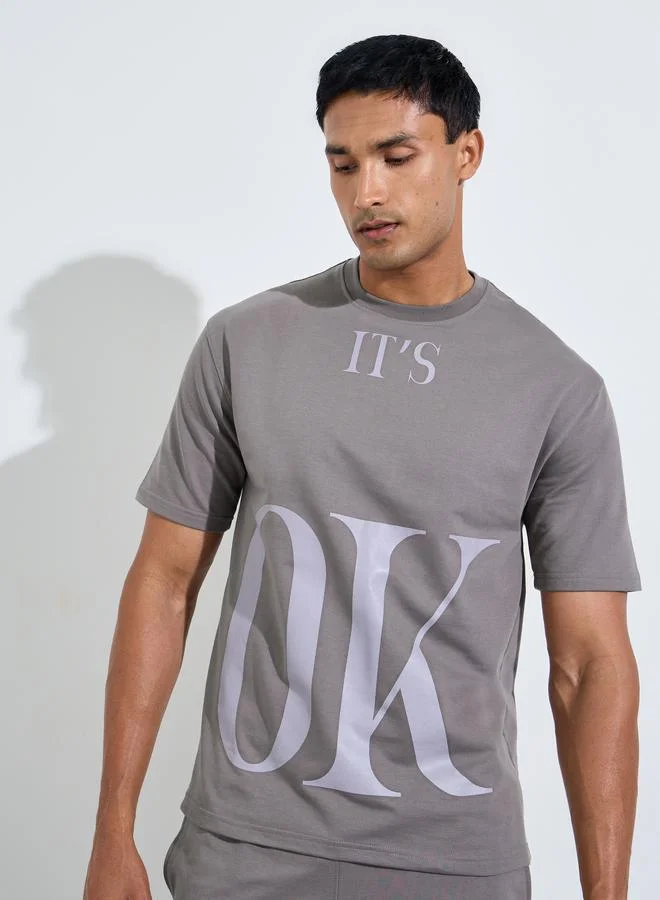 Styli Men Slogan Print Oversized T-Shirt and Joggers Set