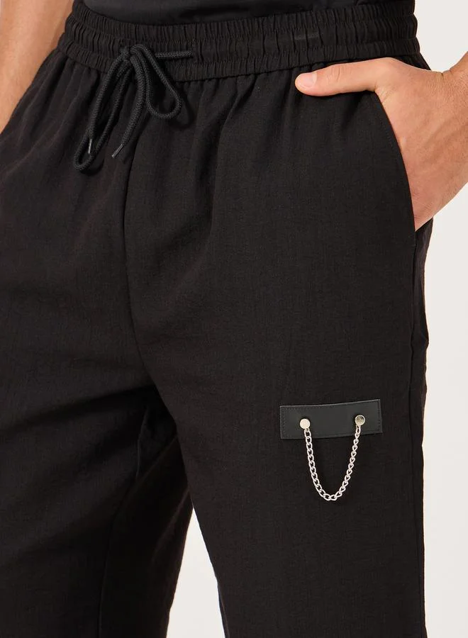 Take Two Solid Drawstring Waist Relaxed Fit Pants with Chain Detail by Styli