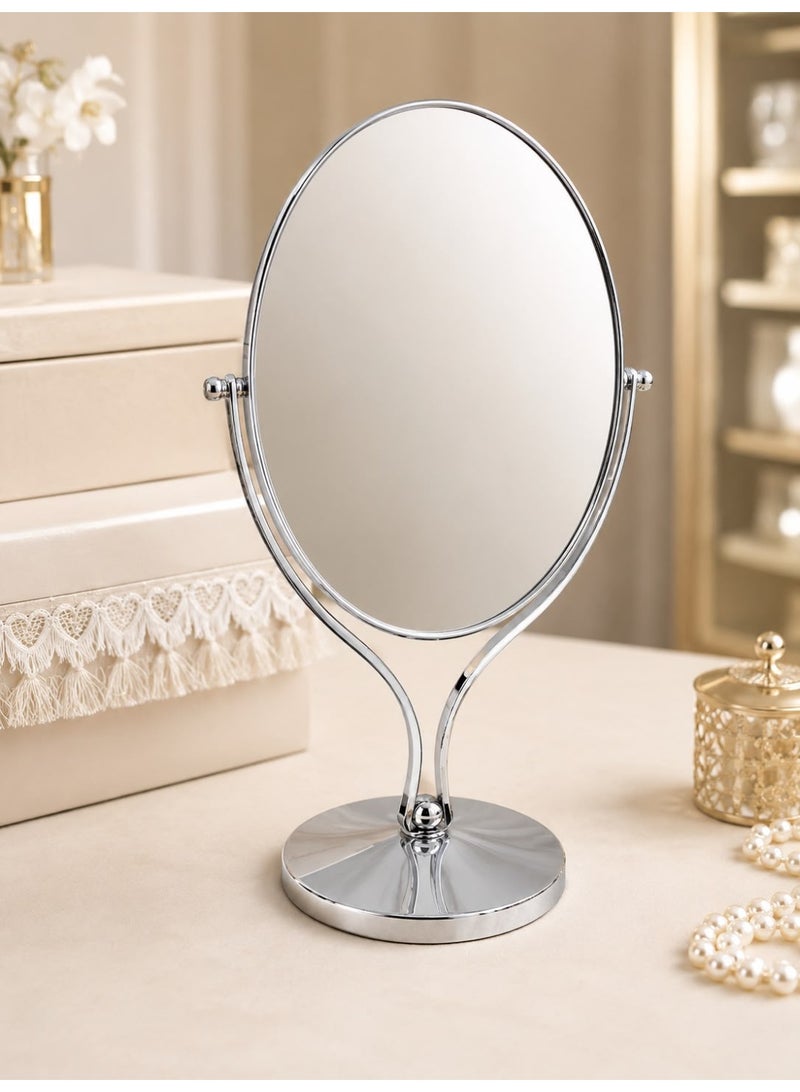 Double-sided table mirror with a swivel silver metal base.