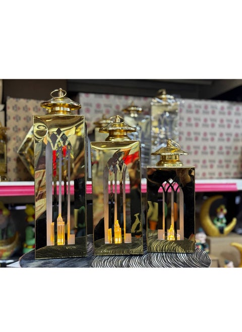 Gold metal hexagon lanterns set 3 pieces In addition to the 3-piece electronics wax kit You can add a distinctive and attractive metal character to your home decor, a luminous masterpiece with a wonderful design. It adds a touch of sophistication and elegance to your home decor. The lantern is made of elegant metallic ornate metal, which is a luminous decoration. It fills the surroundings of the area with a beautiful, softly bright glow.