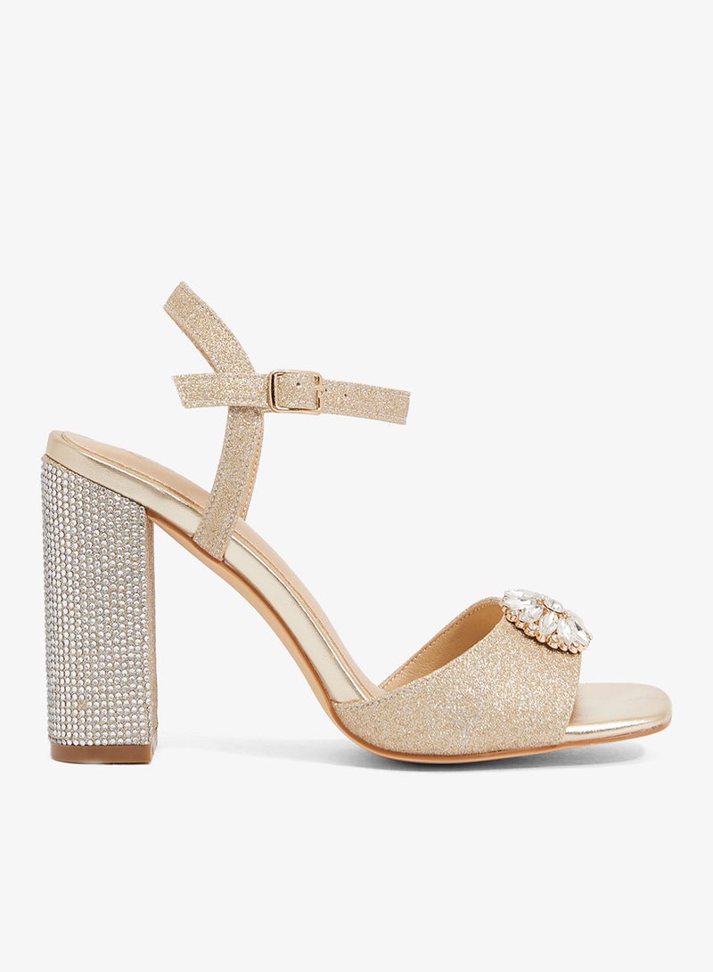 Khizana Champagne gold block heel sandal with rhinestone heel and crystal brooch - Image 1
