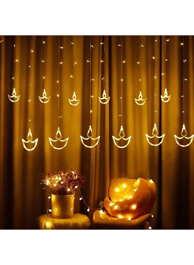 Desidiya Warm White Diya/Diwali Light Curtain, Led String Copper Lights with Pack of 12 Hanging Diyas, 8 Flashing Modes, Decoration, Prong Base, 2.5 Meters - Image 1