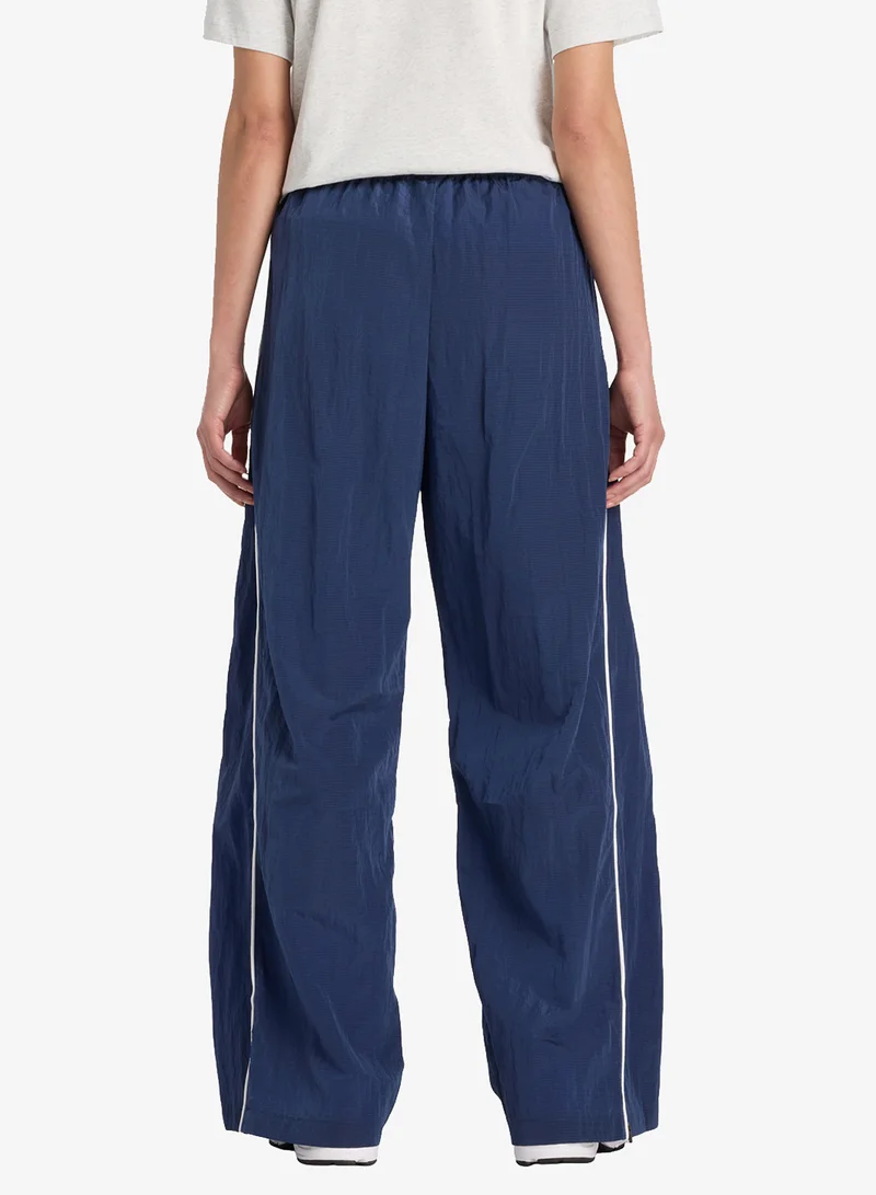 New Balance Essentia Legacy Woven Pants