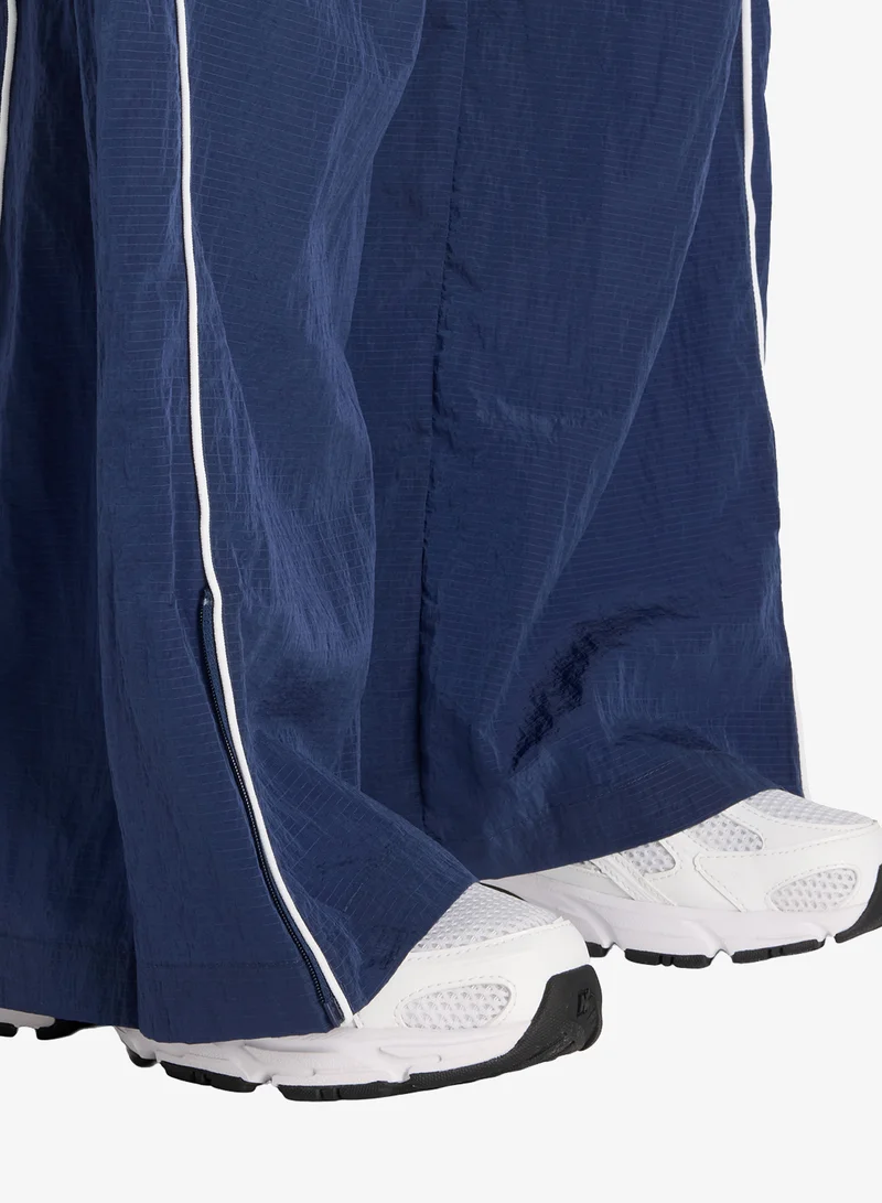 New Balance Essentia Legacy Woven Pants