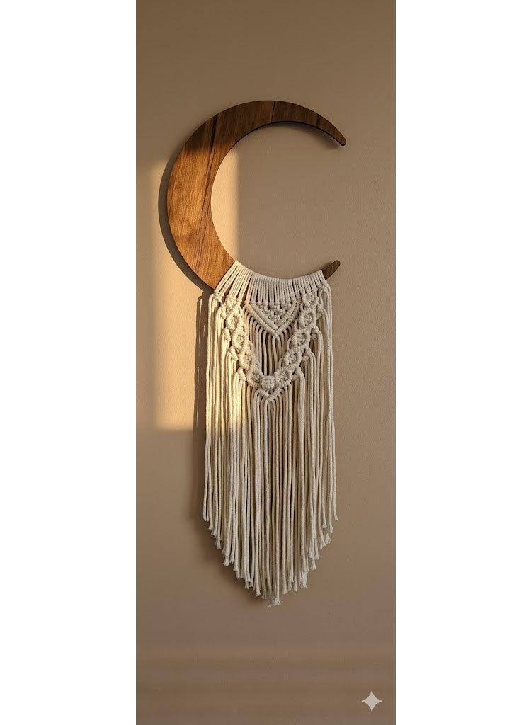 Handmade macramé crescent design, crafted from natural cotton threads, adds a touch of artistry and tranquility to any space. - Image 1