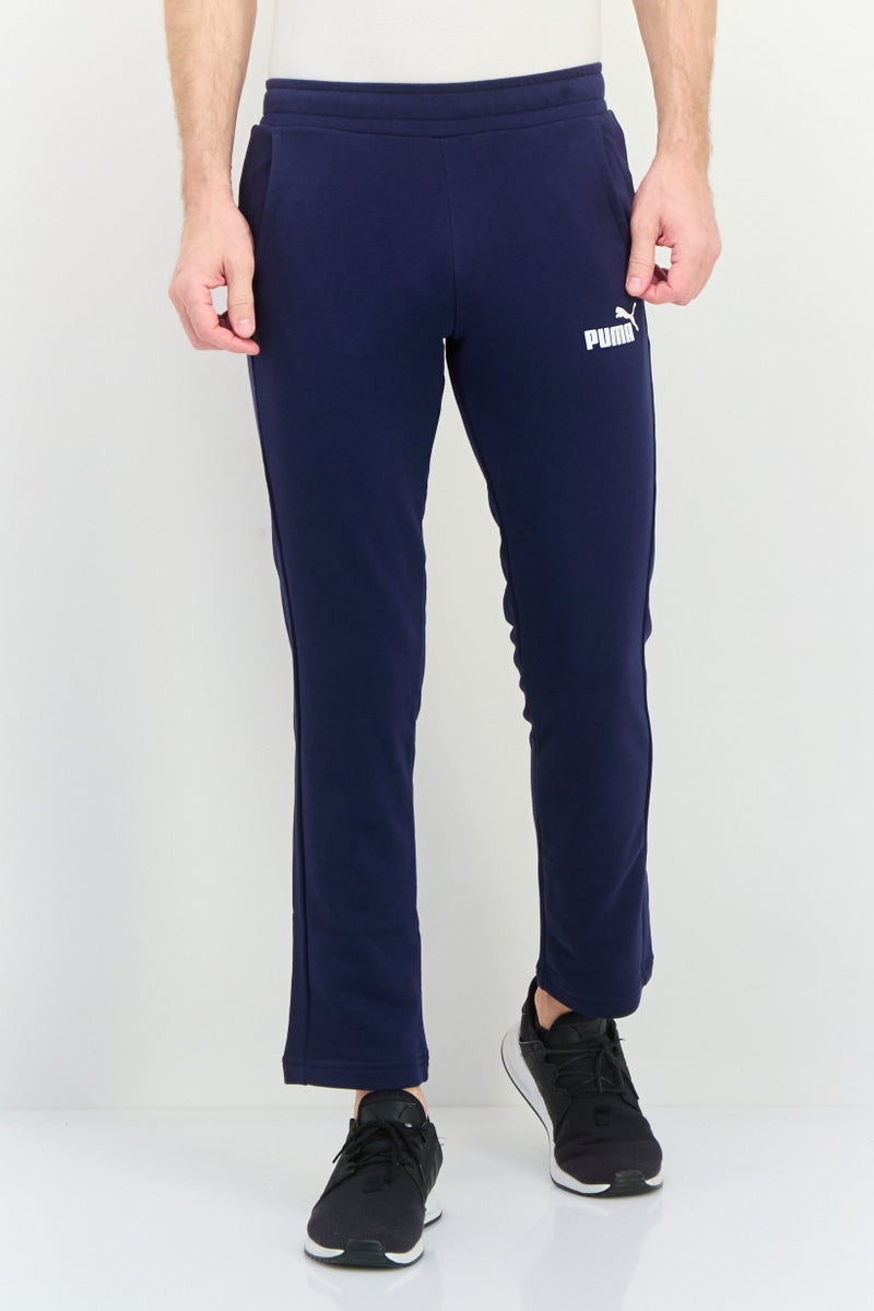 PUMA سروال رياضي للرجال بتصميم ملائم بشعار العلامة التجارية، أزرق داكن - Image 1