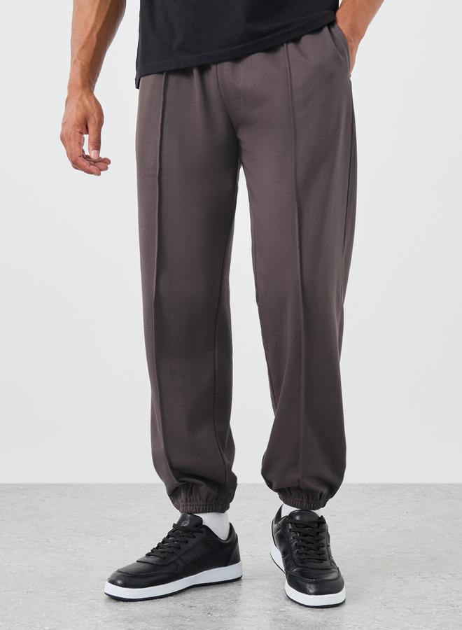 Styli Styli Men Coffee Brown Solid Pintuck Relaxed Fit Joggers  - Image 1