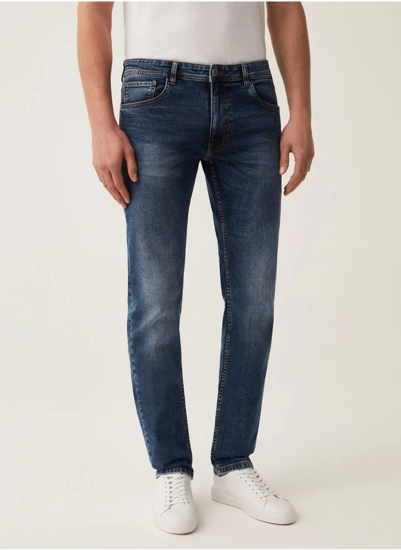 او في اس Faded, slim-fit stretch jeans