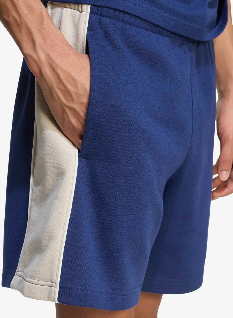 Adidas DKBLUE/WONALU Seasonal Essential Colourblock Fleece Shorts for Men | Best Price UAE