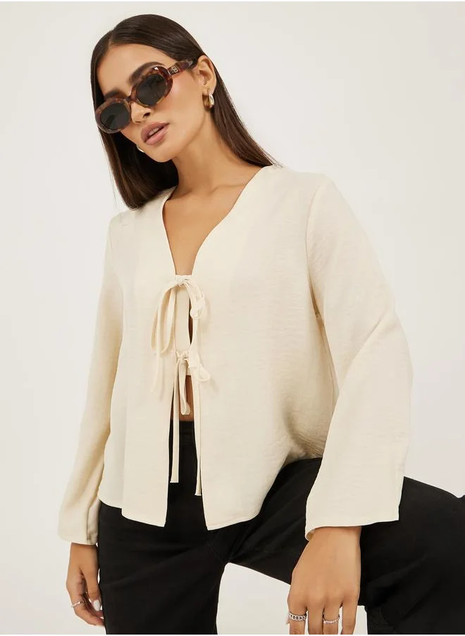 ستايلي Styli Plain V Neck Linen Look Top with Tie Detail