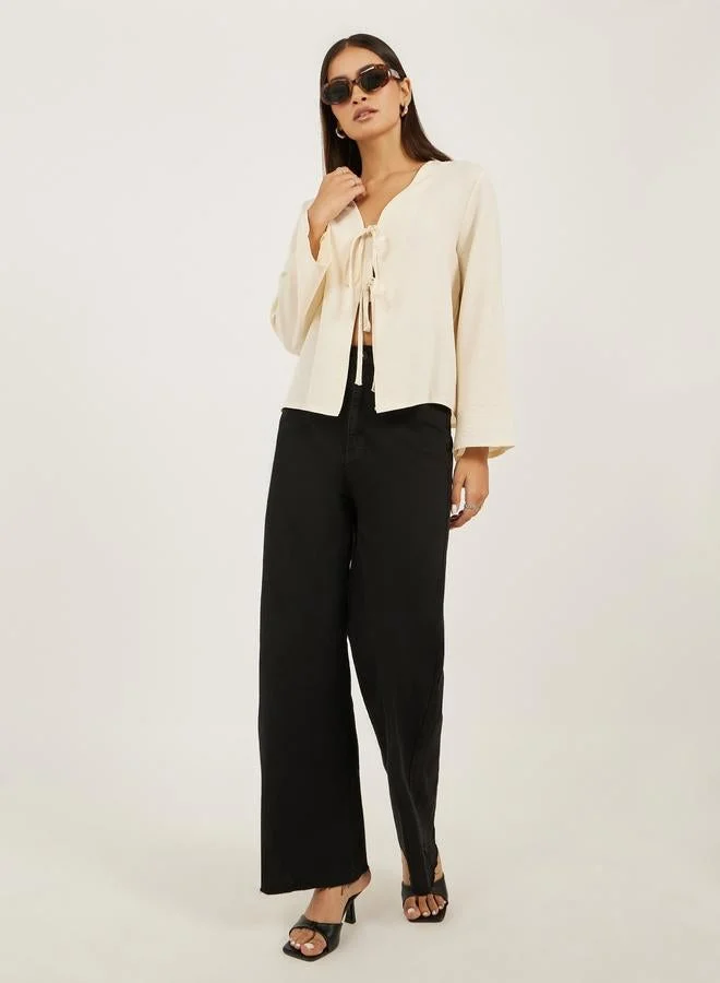 Styli  Styli Plain V Neck Linen Look Top with Tie Detail for Women | Best Price UAE