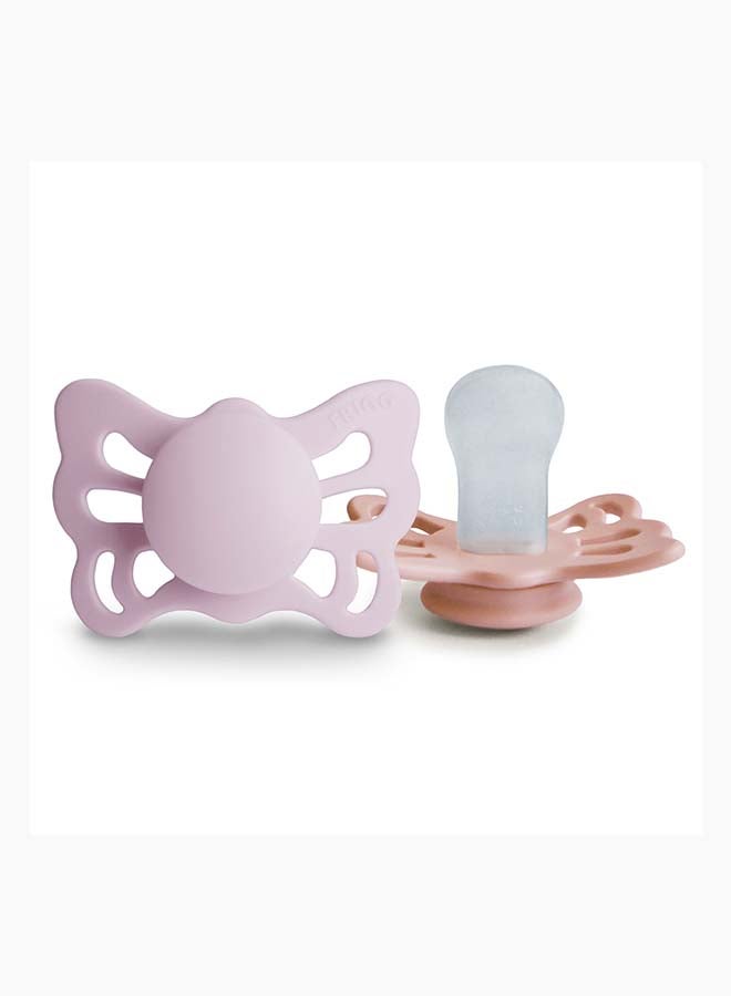 FRIGG لهاية FRIGG بتصميم فراشة أناتوميكية من السيليكون للأطفال 0-6 أشهر 2-Pack لون ليلك الناعم/جميل في الخوخ - الحجم 1 - Image 2